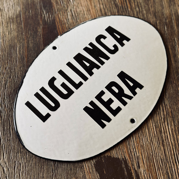 LUGLIANCA NERA – Enameled Sign